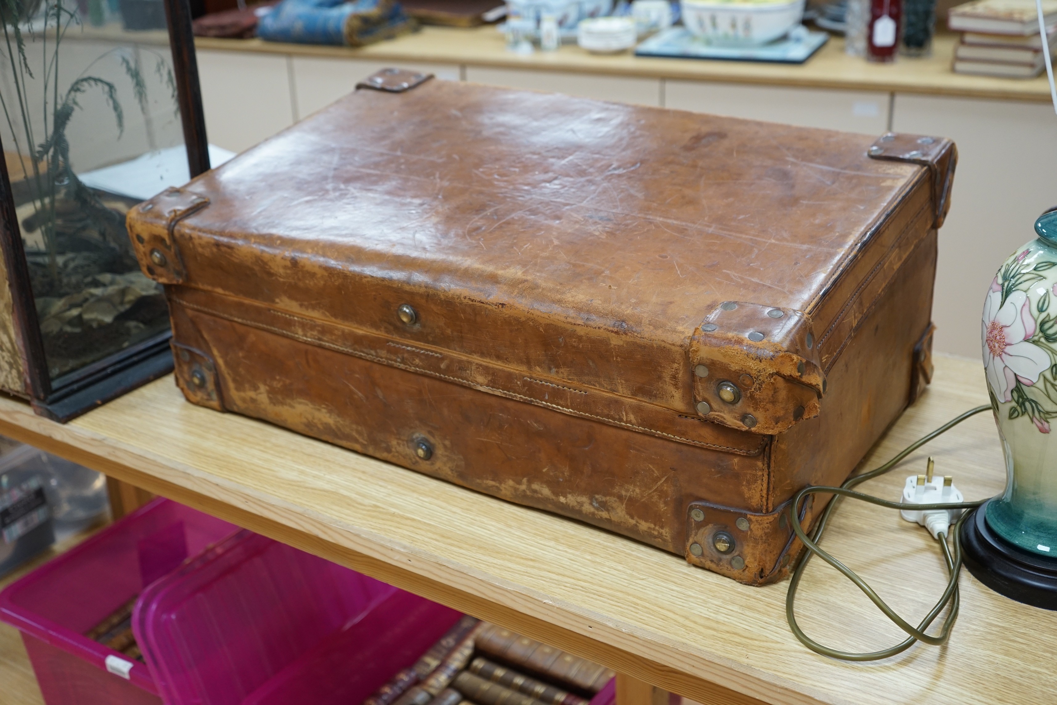A Dupont travel suitcase, initialled ‘L.C.’ with French white metal mounted bottles
